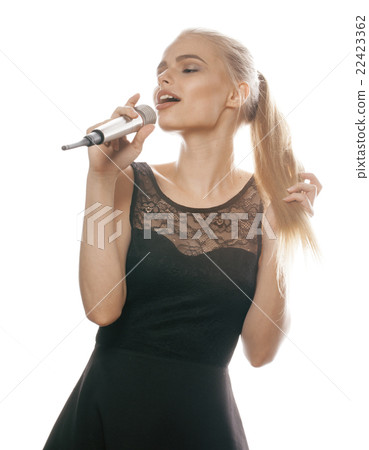 young pretty blond woman singing in microphone 22423362