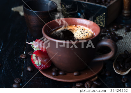 Coffee cup and saucer on a wooden table. Coffee cup and saucer on a wooden table. 22424362