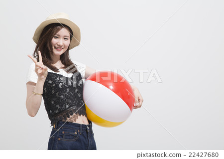 A woman with a beach ball 22427680