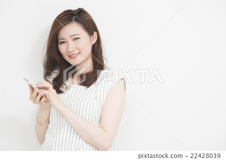 Woman using a smartphone Woman using a smartphone 22428039