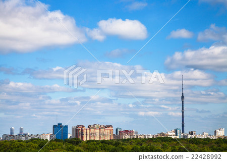 city and forest under cloudy blue sky in summer 22428992