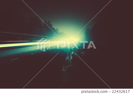 Car light trails in the road at night 22432617