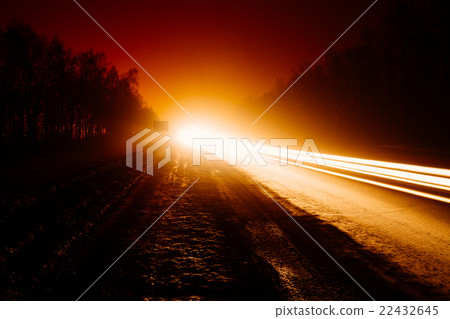 Car light trails in the road at night 22432645