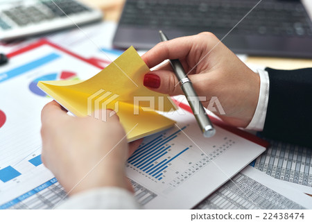 woman tears off sticker 22438474