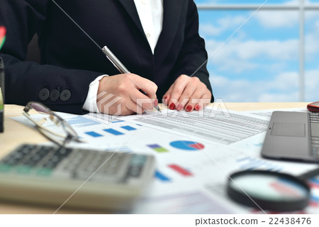 businesswoman working on businessplan businesswoman working on businessplan 22438476