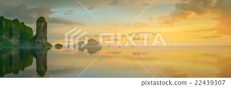 sunset with colorful sky and boat on the beach 22439307