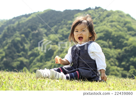 Infant eating a snack (1 year old child) Infant eating a snack (1 year old child) 22439860