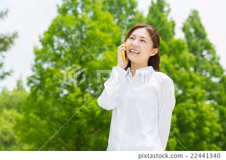 A woman making a phone call 22441340