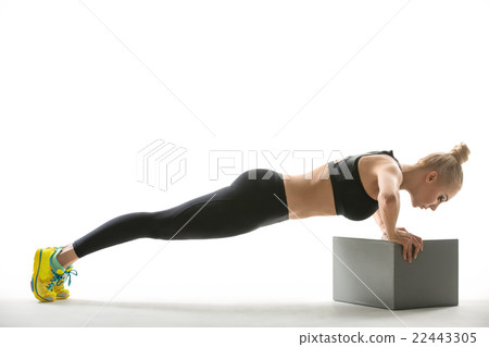 Blonde sports girl with cube stand 22443305