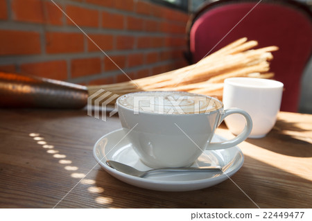 A cup of coffee latte on wood table 22449477