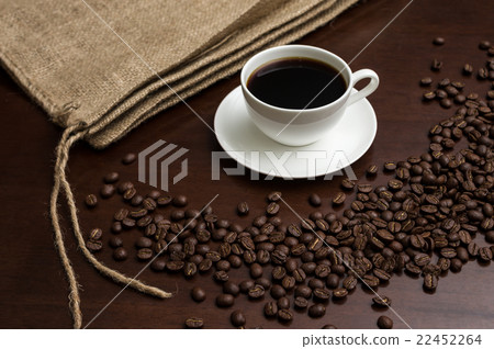 Coffee beans and jacket placed to surround the coffee saucer Coffee beans and jacket placed to surround the coffee saucer 22452264