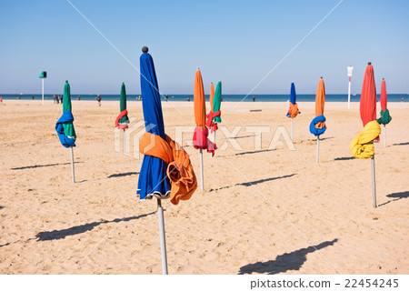 The famous colorful parasols on Deauville beach The famous colorful parasols on Deauville beach 22454245