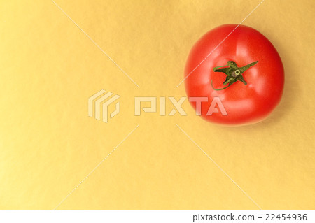 Top view of  red juicy tomato on a gold background 22454936