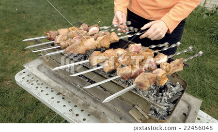 Barbeque skewers with meat cooking on brazier Barbeque skewers with meat cooking on brazier 22456048
