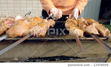 Barbeque skewers with meat cooking on brazier Barbeque skewers with meat cooking on brazier 22456049