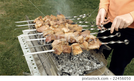 Barbeque skewers with meat cooking on brazier Barbeque skewers with meat cooking on brazier 22456050