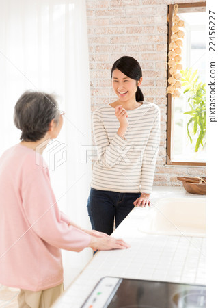 Family chatting in the kitchen Family chatting in the kitchen 22456227