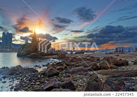 Light House at sea Cove at Sunset 22457345