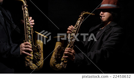 A saxophone player in a dark background A saxophone player in a dark background 22458632