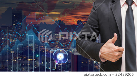 businessman showing thumb up on Trading graph on the cityscape at night and world map background,Business financial concept businessman showing thumb up on Trading graph on the cityscape at night and world map background,Business financial concept 22459206