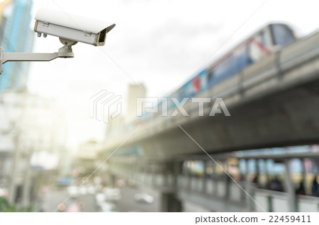 CCTV security camera on the abstract Blurred photo of sky train with traffic jam 22459411