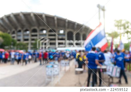 Abstract blurred photo of fan sport with music instrument for cheer and thailand flag at stadium, sport background concept 22459512