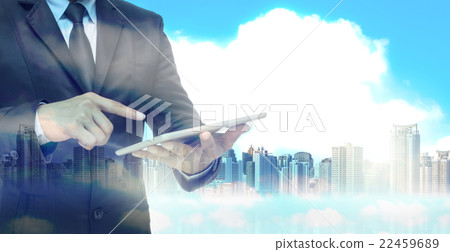 Double exposure of businessman using the tablet on cityscape background, business concept 22459689