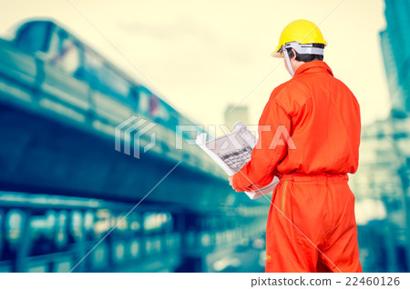 Portrait of Asian engineers looking at the blueprint on abstract Blurred photo of sky train, transportation industrial concept Portrait of Asian engineers looking at the blueprint on abstract Blurred photo of sky train, transportation industrial concept 22460126