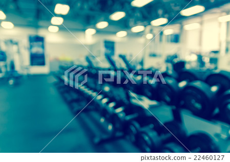 Abstract blurred photo of Dumbbells in modern luxury fitness center Abstract blurred photo of Dumbbells in modern luxury fitness center 22460127