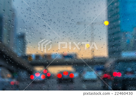 Rain drop On the car Glass Background with sky train. photo blurred of car on the Street Rain drop On the car Glass Background with sky train. photo blurred of car on the Street 22460430
