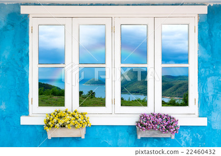 Beautiful Flowers Outside a Window with Beautiful Nature View with rainbow Beautiful Flowers Outside a Window with Beautiful Nature View with rainbow 22460432