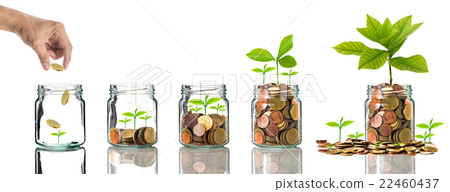 Hand putting gold coins into clear bottle on white background,Business investment growth concept Hand putting gold coins into clear bottle on white background,Business investment growth concept 22460437