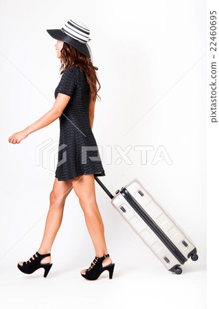 Attractive tourist woman with suitcase on isolated Attractive tourist woman with suitcase on isolated 22460695