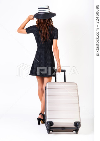 Attractive tourist woman with suitcase on isolated Attractive tourist woman with suitcase on isolated 22460699