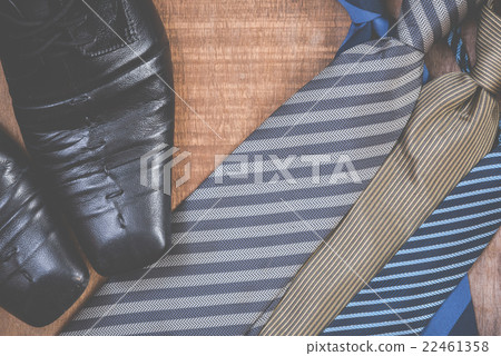 Necktie and shoes on grunge wood background 22461358