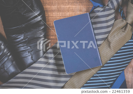 Necktie and shoes,passport on grunge woodden Necktie and shoes,passport on grunge woodden 22461359