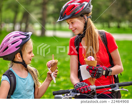 Bikes cycling girls with rucksack cycling eating 22464908