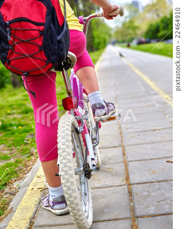 Bikes bicyclist girl. Children feet and bicycle Bikes bicyclist girl. Children feet and bicycle 22464910