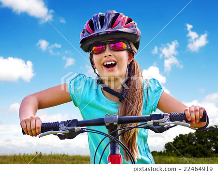 Bikes cycling girl wearing helmet rides bicycle. 22464919