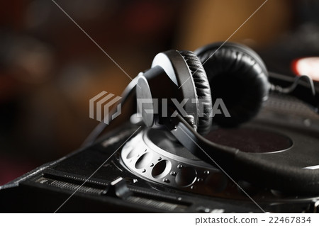 DJ headphones on CD music player DJ headphones on CD music player 22467834