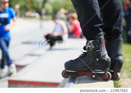 Aggressive inline rollerblader in skatepark Aggressive inline rollerblader in skatepark 22467882