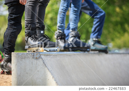 Aggressive inline rollerblader in skatepark Aggressive inline rollerblader in skatepark 22467883