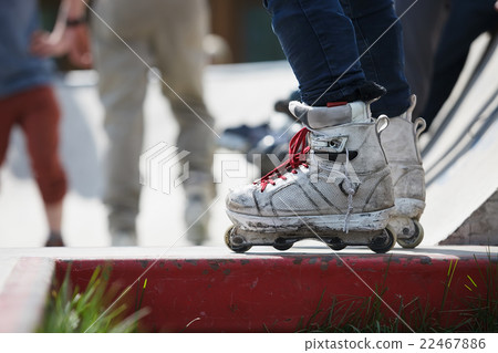 Aggressive inline rollerblader in skatepark Aggressive inline rollerblader in skatepark 22467886
