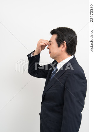 A businessman who is tired of eyes A businessman who is tired of eyes 22470580