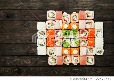Set of sushi maki and rolls at black rustic wood. Set of sushi maki and rolls at black rustic wood. 22472659