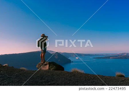 Photographer takes picture caldera, Oia, Santorini 22473495