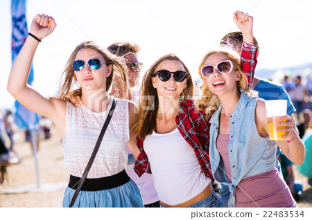 Group of teenagers at summer music festival, sunny 22483534