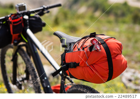Bicycle with orange bags for travel Bicycle with orange bags for travel 22489517