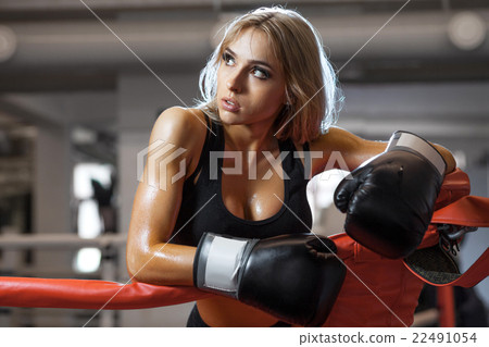 Young pretty boxer woman standing on ring - Stock Photo [22491054] - PIXTA