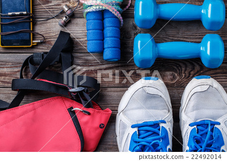 Shoes and sports equipment on wooden floor, top Shoes and sports equipment on wooden floor, top 22492014